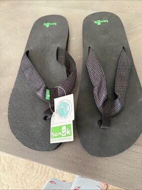 Sanuk Black Flip Sandals with Green Logo Accent